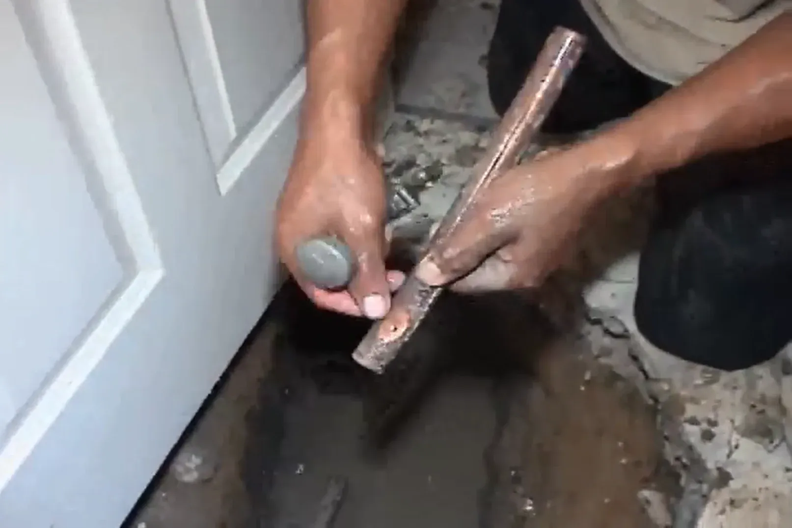 Corroded copper water pipe removed from under a Prescott home slab, showing the cause of a slab leak